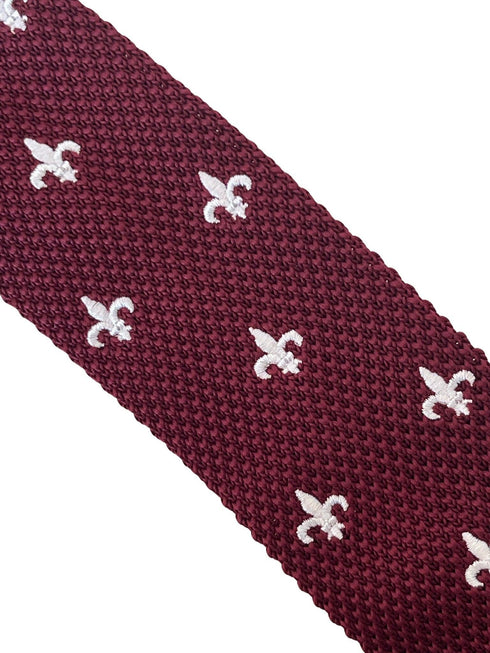 maroon knitted tie with white embroidered fleur de lis lys design